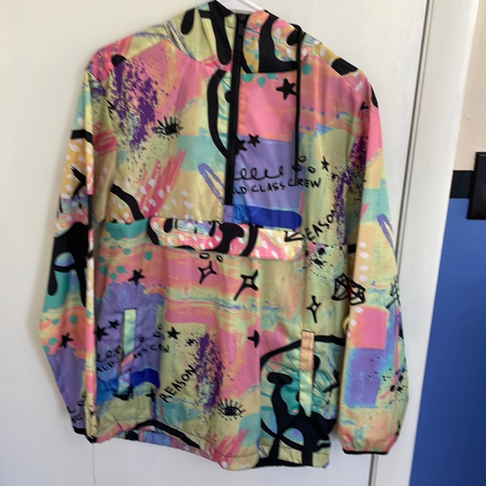 Multi color rain jacket, big pocket, very fun piece of clothing